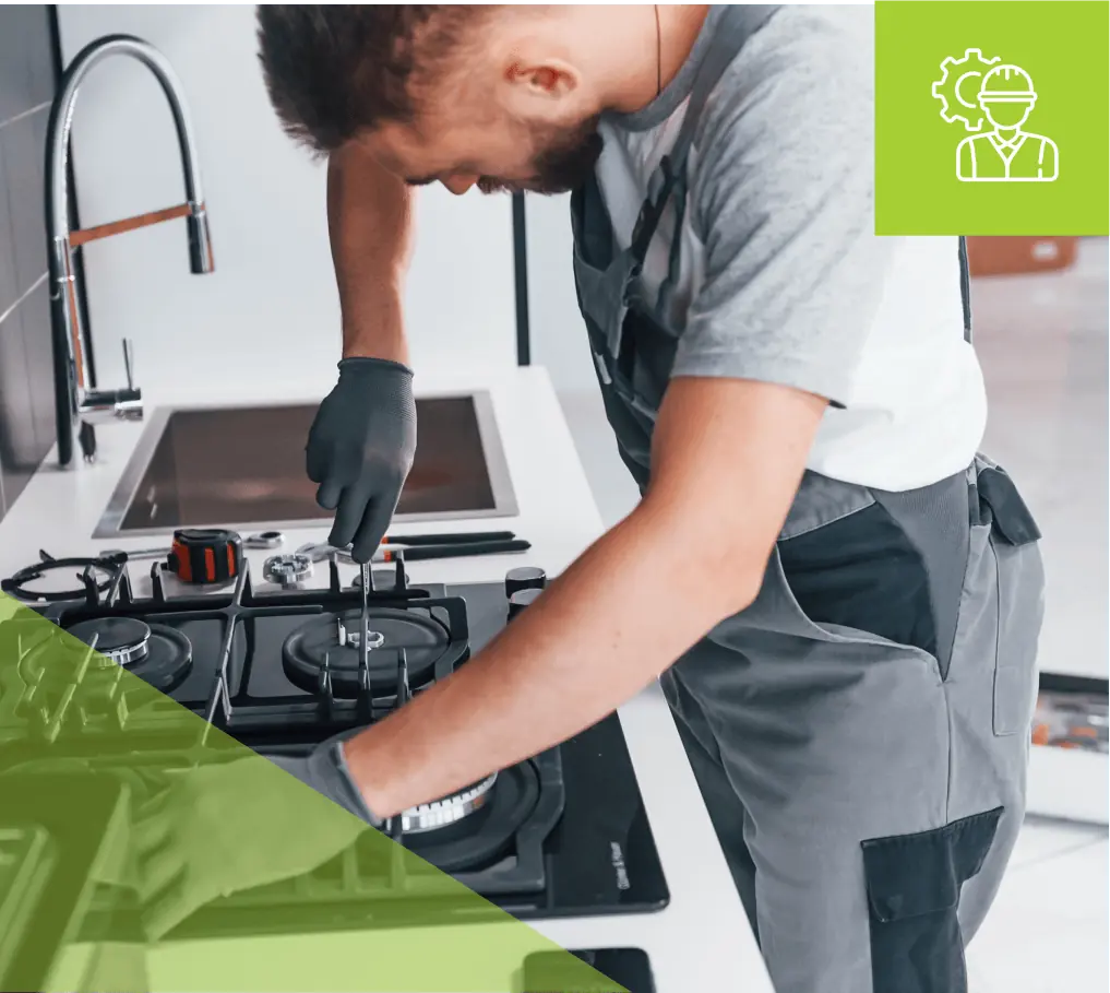 Technician repairing a gas stove