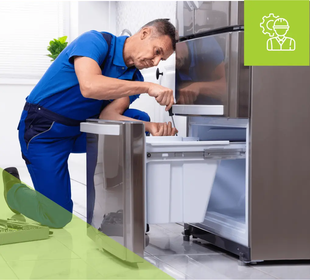 Technician repairing a refrigerator