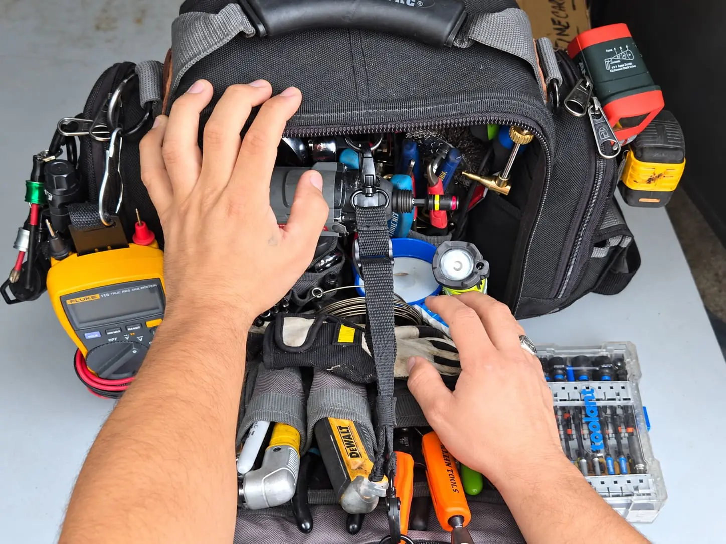 Appliance repair technician diagnosing a home appliance in New Jersey